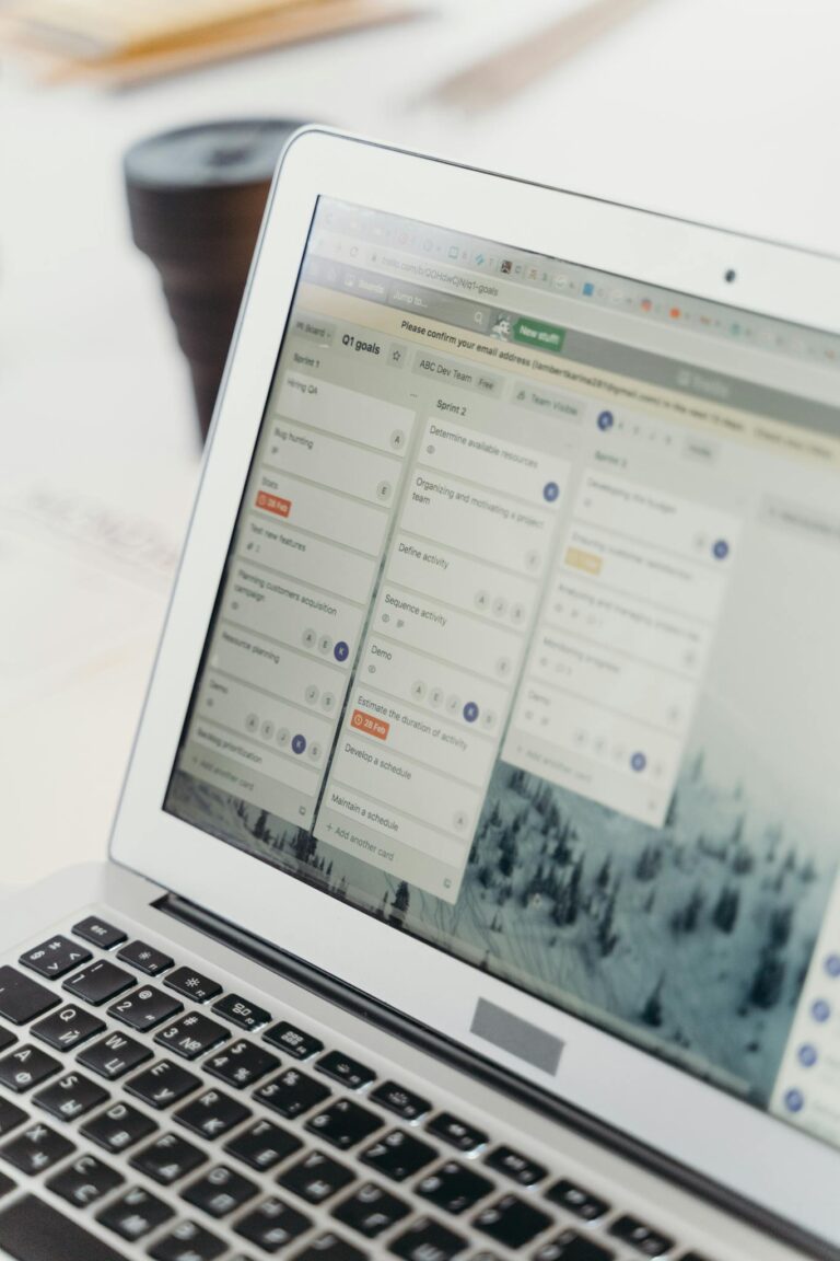 Close-up of a laptop screen showing project management software interface. Perfect for business or tech themes.